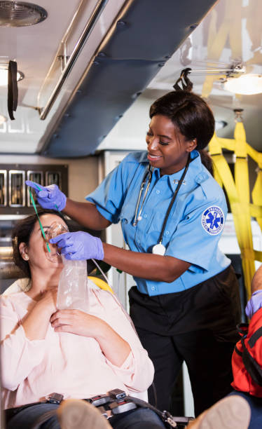istock Paramedic helping Hispanic woman in ambulance 1200806021