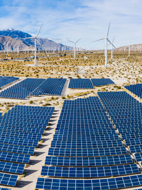 istock Aerial View over Solar Panels and Windmills 1200806344