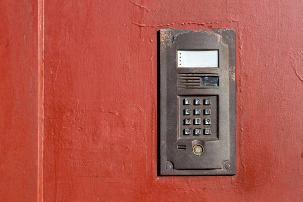 istock an intercom on metall old door with a keypad for calling close up with copy space. 1200809075