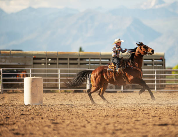 istock Young cowboy barrel racing rodeo 1200810045
