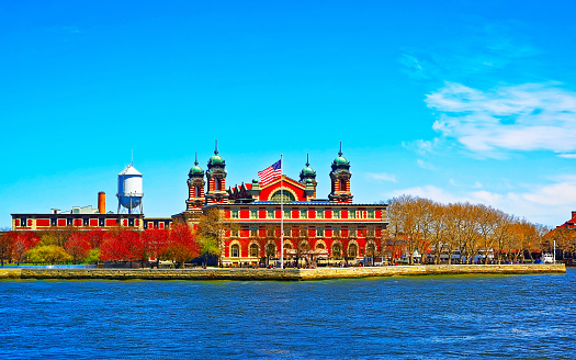 Ellis Island in Upper New York Bay. It was a gateway for immigrants. Manhattan area, New York City, America USA. American architecture building. Metropolis NYC. Cityscape. Hudson, East River