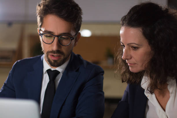 istock Focused business people working with laptop 1200817344