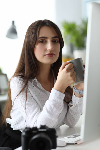 istock Cute lady enjoying cup of tea 1200829452