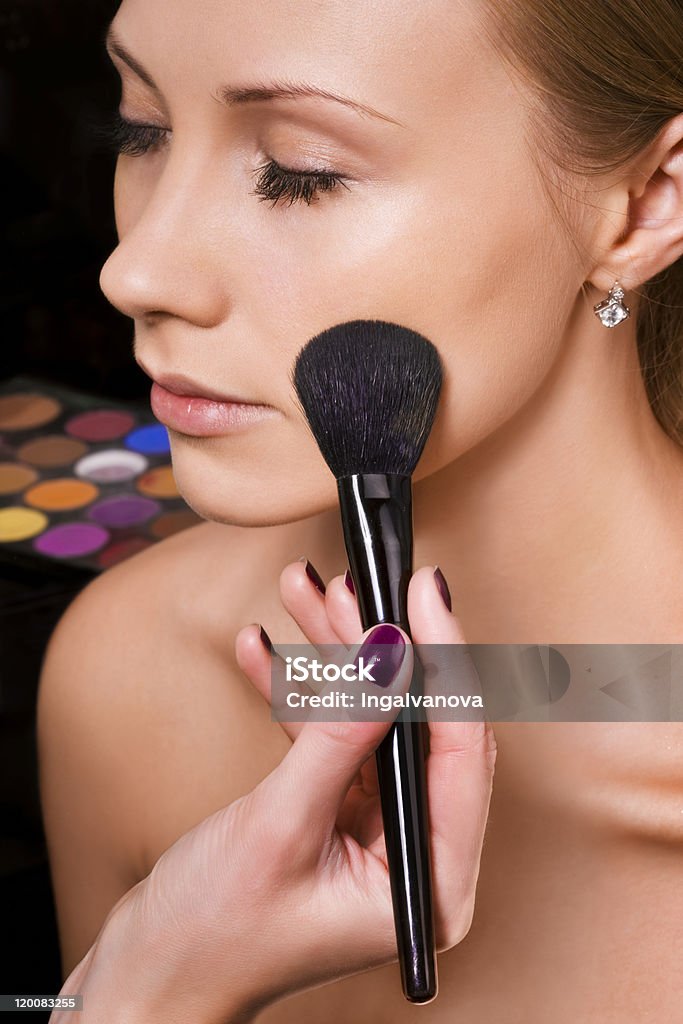 Makeup Makeup artist applying blusher Adult Stock Photo