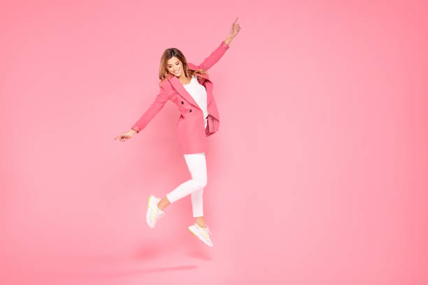 istock Crazy girl jumping in studio. 1200833837