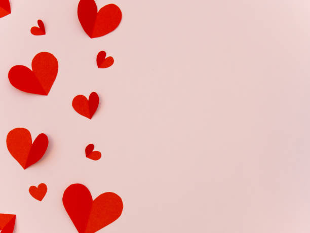 istock Red paper heart valentine day card on pink background with copy space for text 1200846251