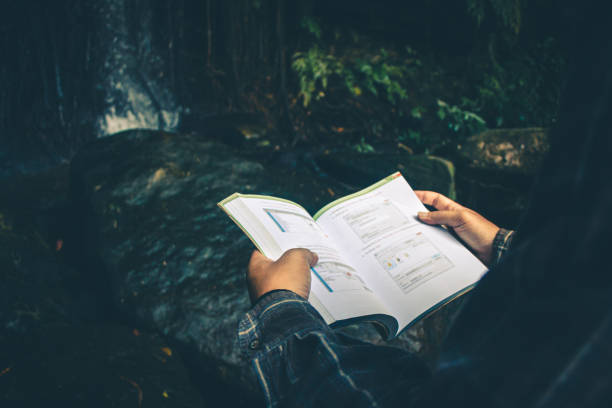 istock Men read book in quiet nature, Concept read a book. 1200847152