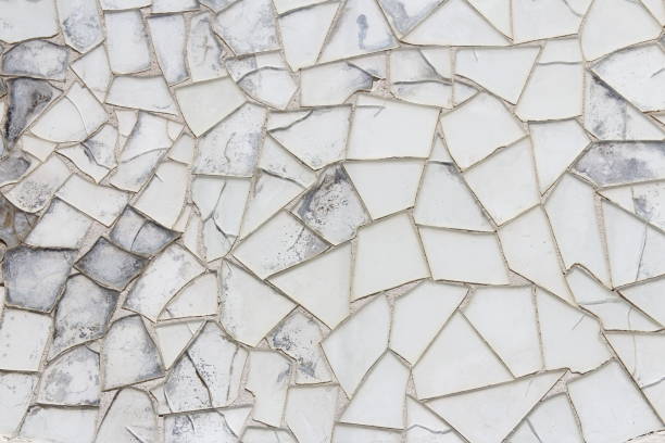 istock Mosaic tile design with broken pieces in different size and tones 1200847198