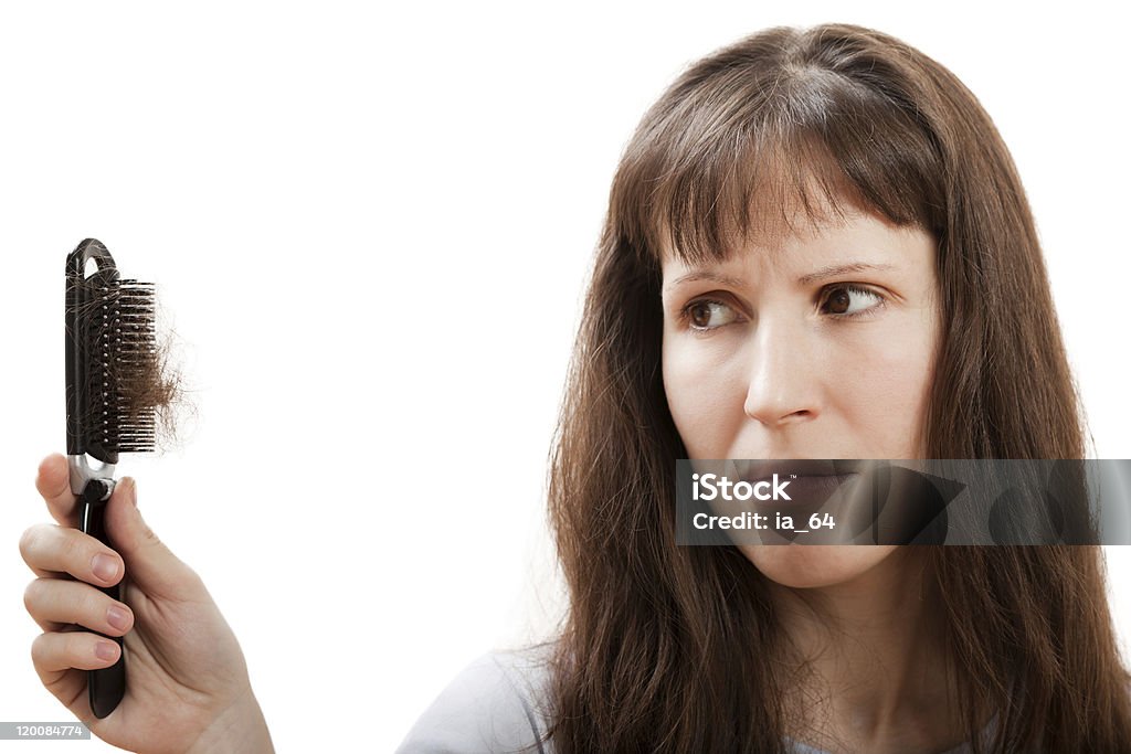 Woman holding hair brush full of hair Balding problem women hand holding loss hair comb Adult Stock Photo