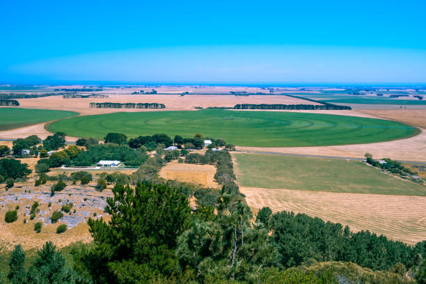 istock Round green field in Australian countryside under blue sky 1200849209