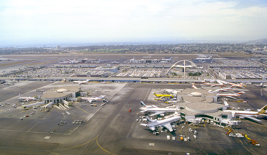 Aerial view of Los Angeles International Airport (LAX) with the  Googie architectural style Theme Building right of center. Los Angeles, California, USA. June 1978. Scanned film.