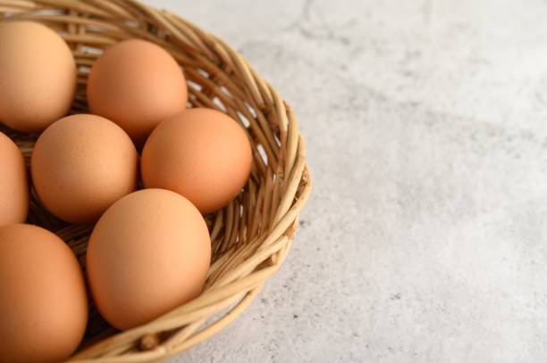 istock Close up organic brown eggs several in a wicker basket, preparing preparing for cooking food or dessert, copy space 1200857298