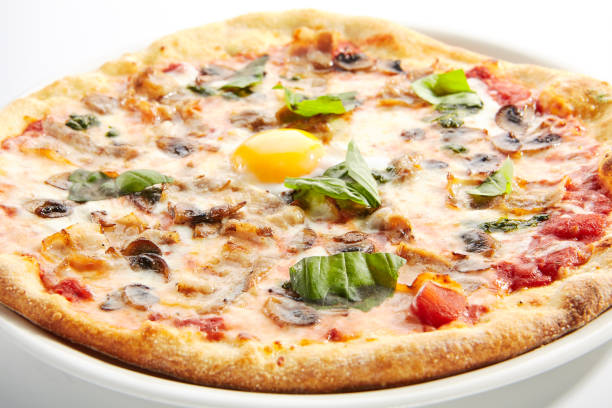 istock Pizza with Mushrooms, Bacon and Egg in Restaurant Plate Isolated 1200859228