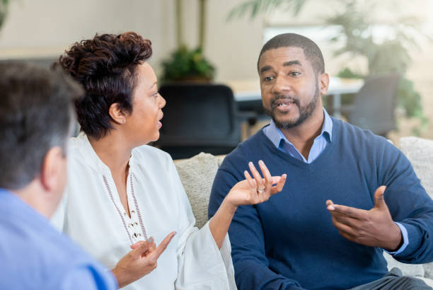 istock Husband and wife arguing during marriage counseling 1200863712