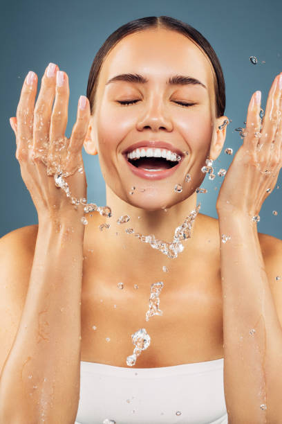 istock Woman washing up her face 1200864137