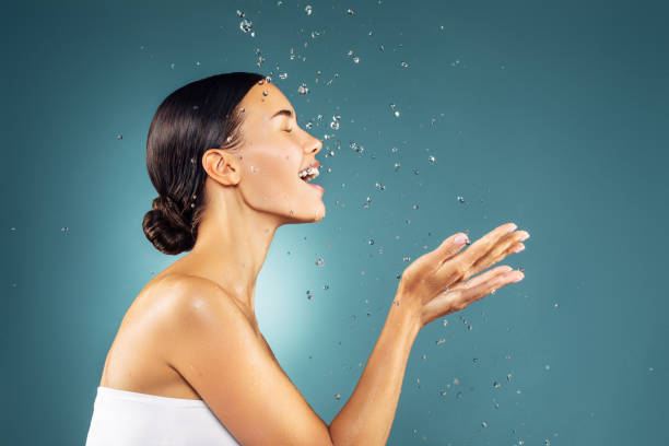 istock Woman washing up her face 1200864165