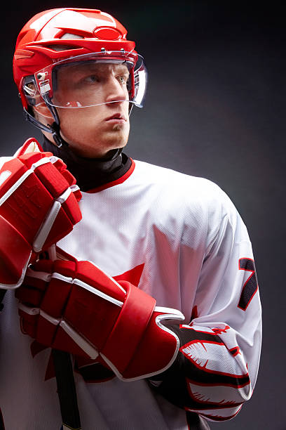 istock A male hockey player in red and white 120086431