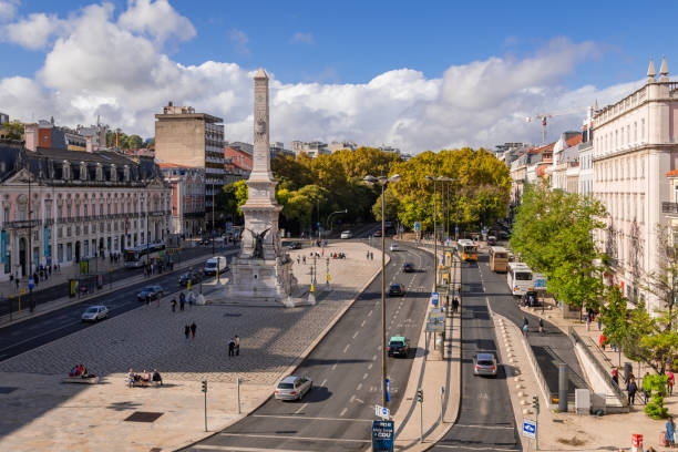 Large view of Restauradores square and monument in the downtown of Lisbon.