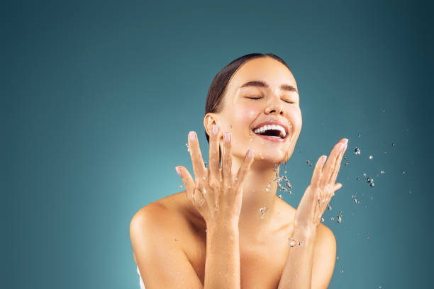 istock Woman washing up her face 1200864753