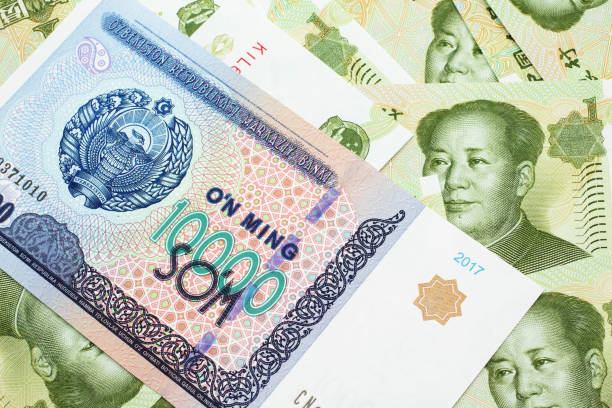 istock A Uzbekistan som bank note with Chinese one yuan bank notes 1200869995