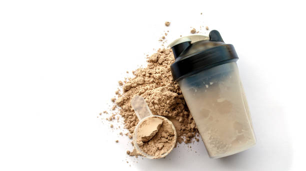 Whey Protein Whey protein powder with shaker for mixing protein stock pictures, royalty-free photos & images