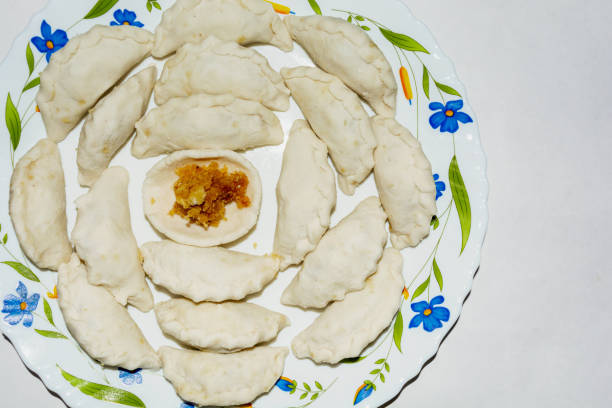 istock Bengali cuisine - puli pitha in a plate. 1200879108