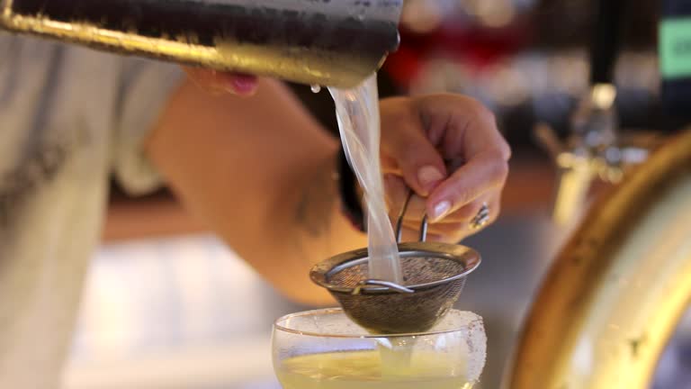 Female Bartender Making Cocktails