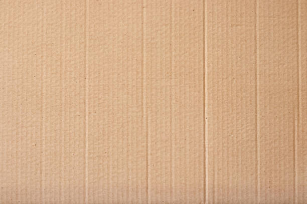 Brown cardboard sheet abstract background, texture of recycle paper box in old vintage pattern for design art work.
