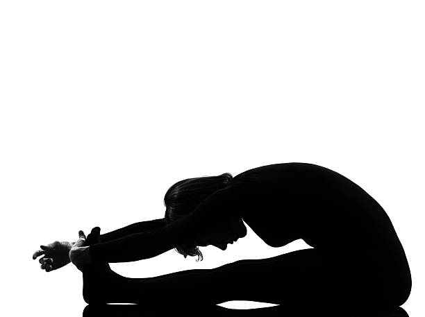 istock woman paschimottanasana yoga pose 120088042
