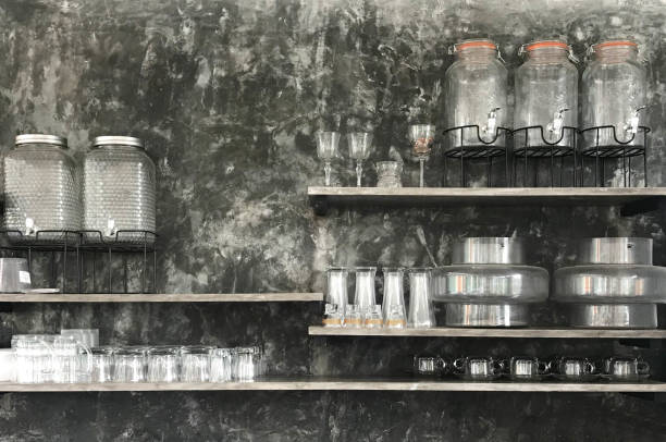 istock Empty glass ware on shelf over loft style or black cement wall 1200880865