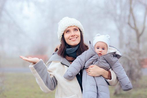 Portrait of a  mom and her daughter in wintertime season