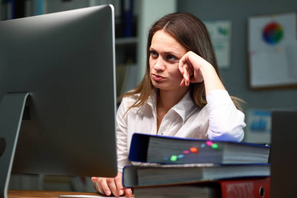 istock Pretty overworked woman at workplace 1200881058