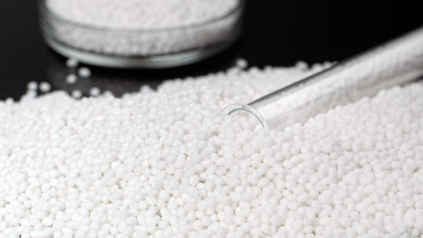 istock Closeup white granules of a plastic polymer 1200883016
