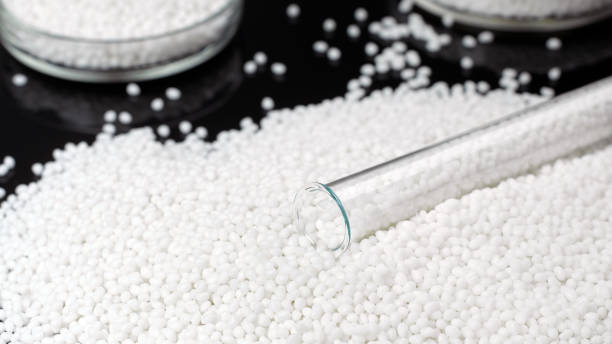istock Closeup white granules of a plastic polymer 1200883019