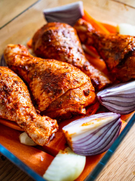 istock Raw marinated chicken legs ready to roast 1200884236