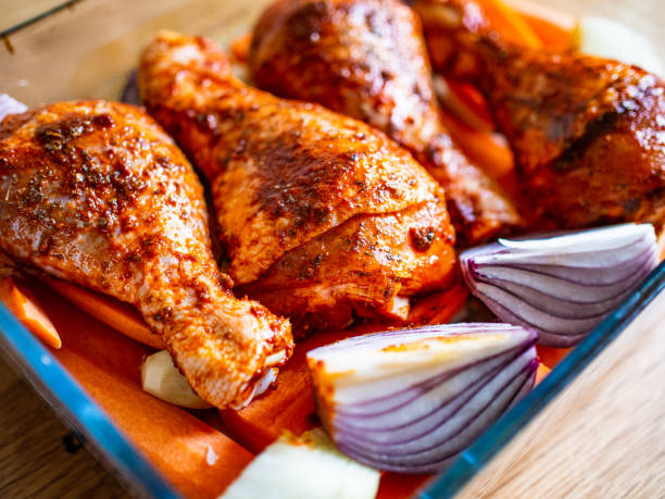 istock Raw marinated chicken legs ready to roast 1200884753