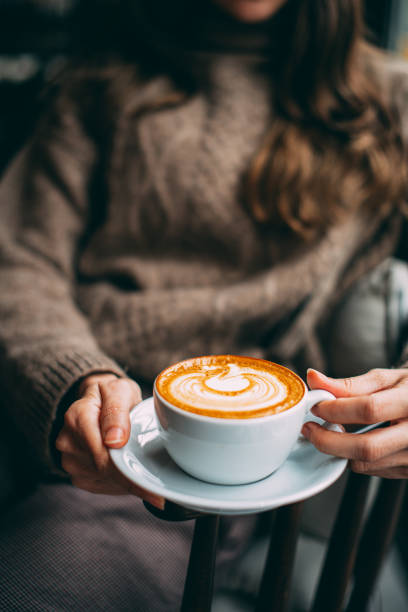 istock Flat Lay Woman Hand Holding Coffee Latte 1200886513