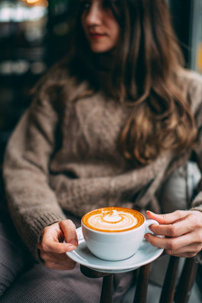 istock Flat Lay Woman Hand Holding Coffee Latte 1200887597