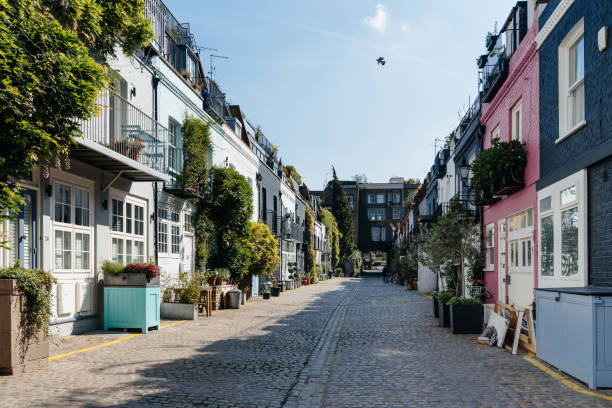 View of the picturesque St Lukes Mews alley in London View of the picturesque St Lukes Mews alley near Portobello Road in Notting Hill, London notting hill stock pictures, royalty-free photos & images