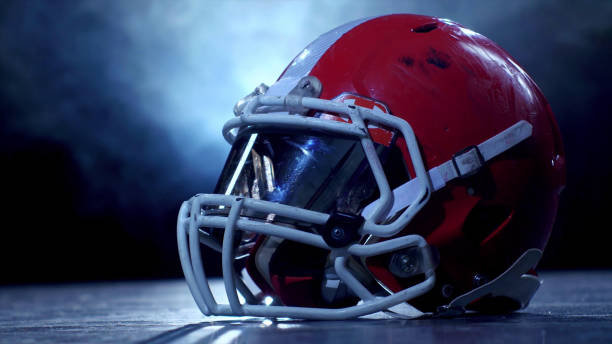 istock American football player red helmet 1200888618