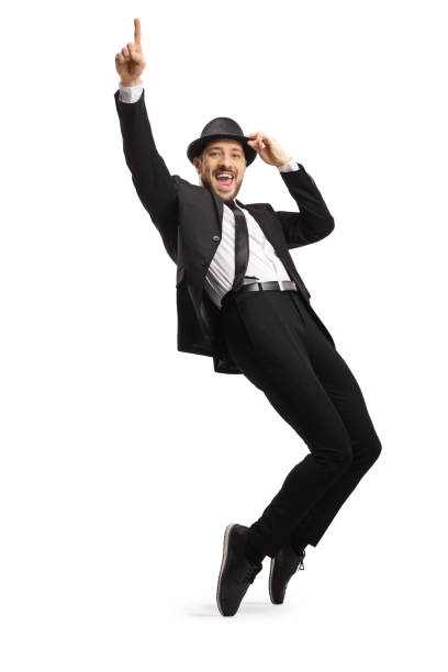 istock Young smiling man in suit dancing on tiptoes 1200888873
