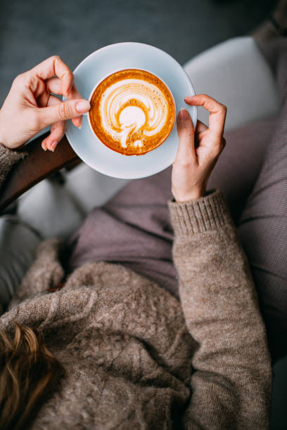 istock Flat Lay Woman Hand Holding Coffee Latte 1200890047