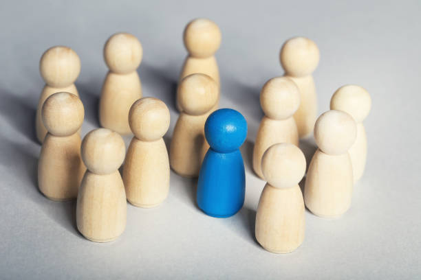 istock Leader concept. Wooden figures on gray background 1200890803