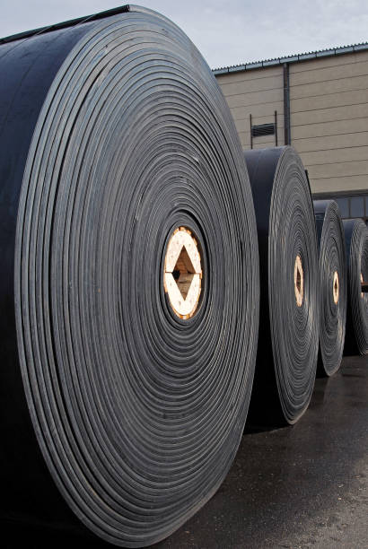 istock New industrial conveyor belts packed in rolls. 1200893316