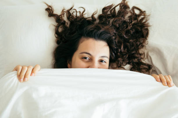 istock woman having fun in bed 1200895022