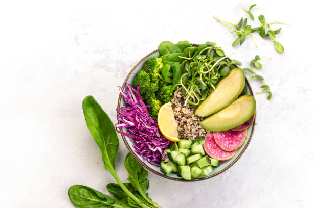 istock Spring detoxifying vegetarian salad  with quinoa red cabbage and sprouts, top down view 1200896362