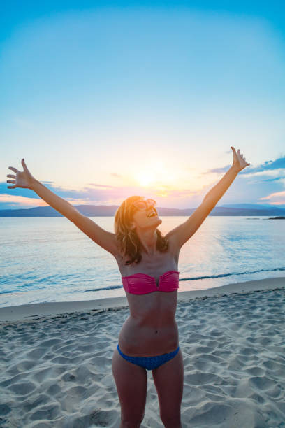 istock Woman enjoying nice tropical summertime days. 1200896449