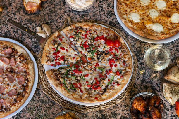 istock Variety of pizzas and tapas on granite table 1200896865