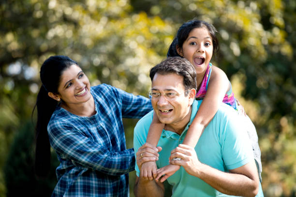 istock Happy family at park 1200899394