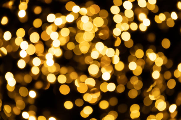 istock abstract background of defocused bokeh yellow night small circle light bulb 1200900141